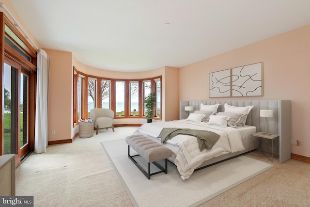 carpeted bedroom with access to outside