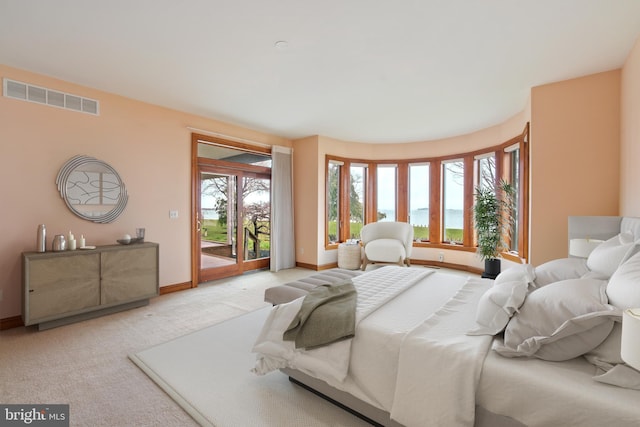 carpeted bedroom with access to exterior