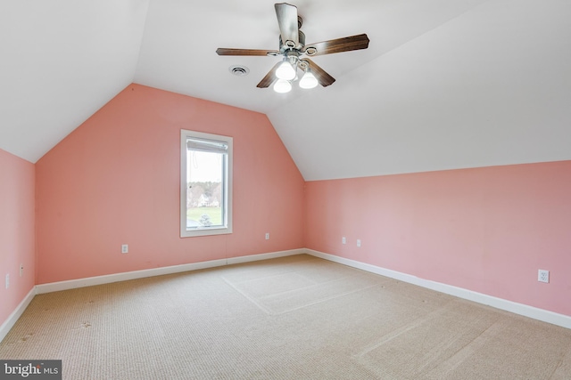 bonus room featuring ceiling fan, light colored carpet, and vaulted ceiling