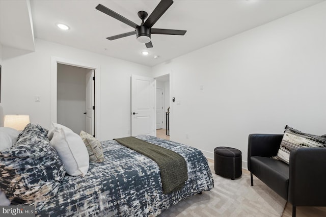 bedroom featuring light carpet and ceiling fan