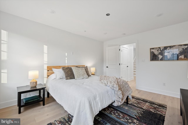 bedroom with light wood-type flooring