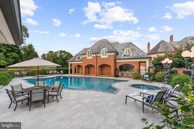 view of swimming pool featuring a patio area