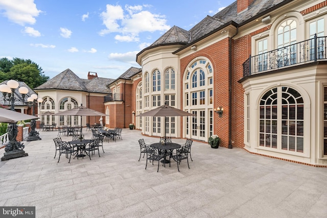 view of patio featuring french doors and a balcony