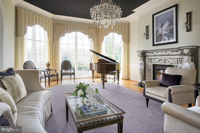 interior space with crown molding, light wood-type flooring, a high end fireplace, and a chandelier