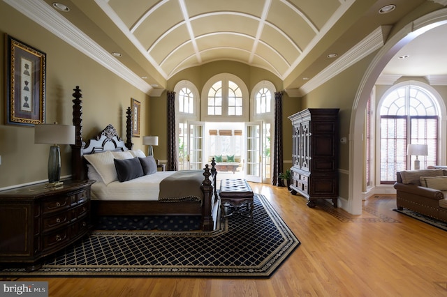 bedroom featuring ornamental molding and light wood-type flooring