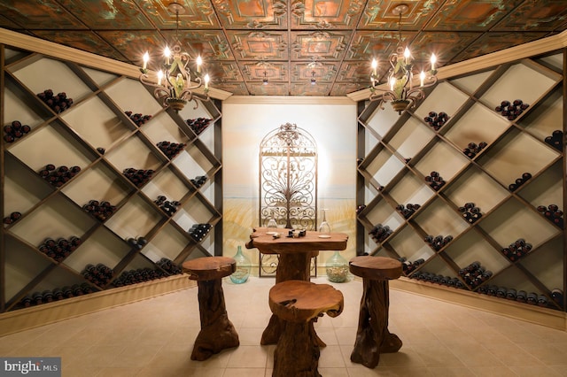 wine cellar featuring an inviting chandelier and light tile floors