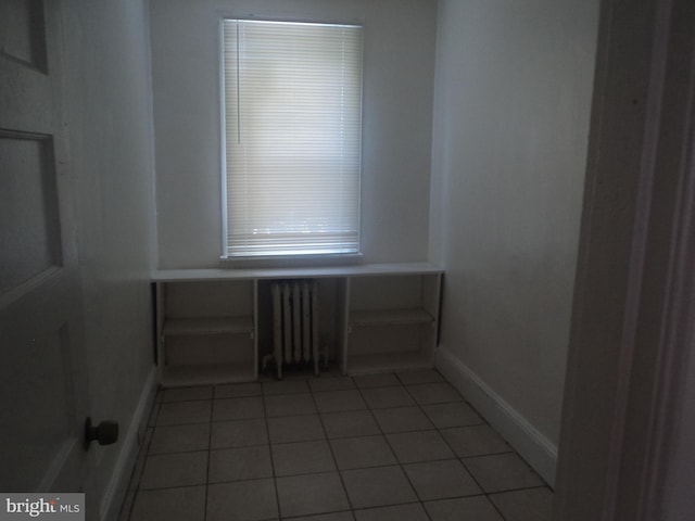 tiled empty room with radiator