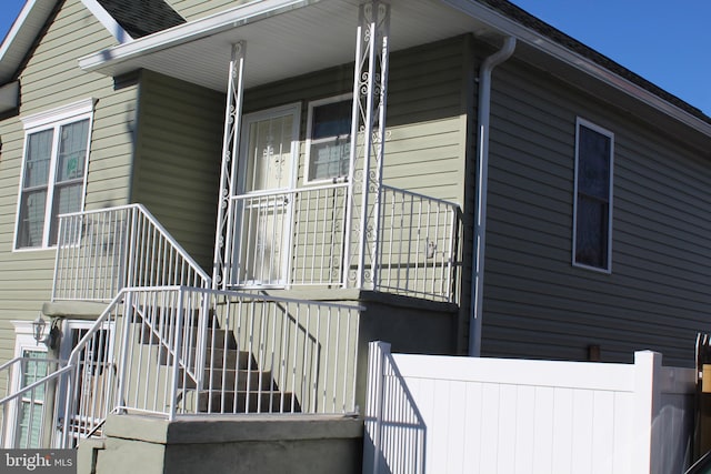 view of side of property with covered porch