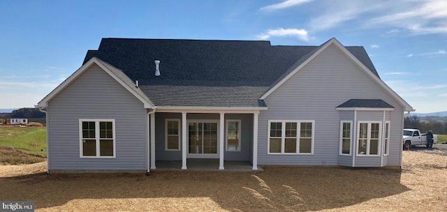 back of house with a patio area