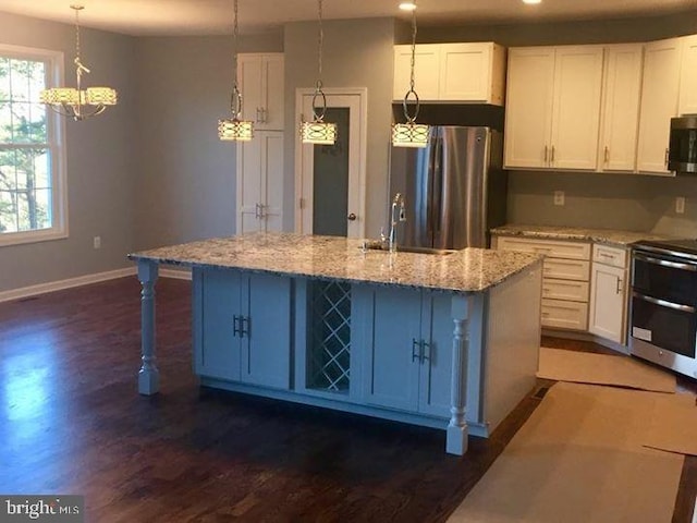 kitchen featuring light stone countertops, stainless steel appliances, dark hardwood / wood-style floors, and white cabinetry