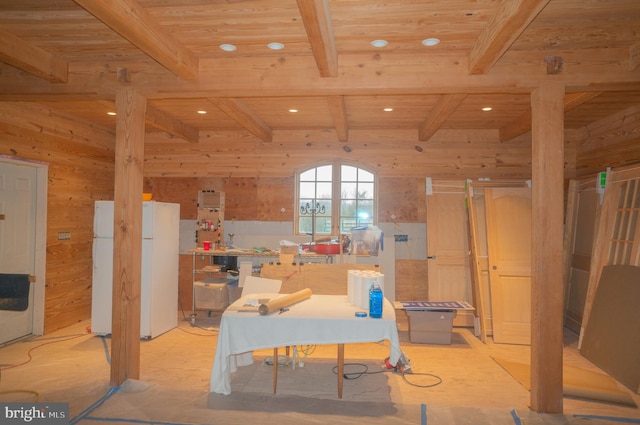 interior space featuring wooden ceiling, wood walls, and beamed ceiling