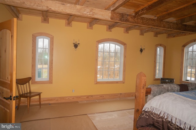 bedroom featuring wood ceiling and beamed ceiling