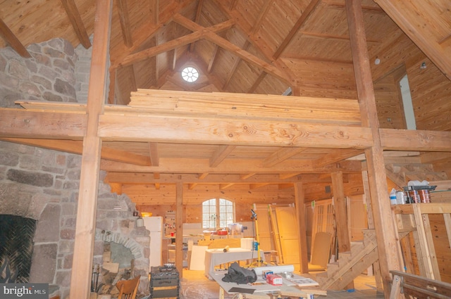 interior details with a fireplace, wooden ceiling, and beamed ceiling