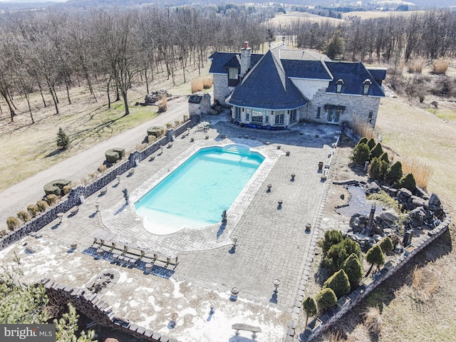 birds eye view of property with a rural view