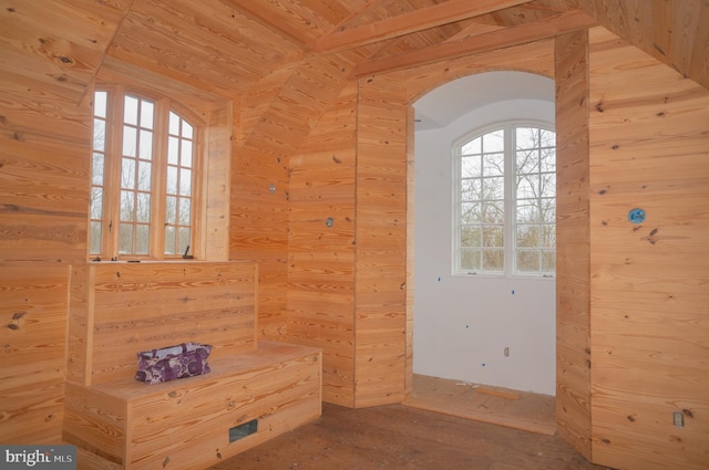 interior space with wooden ceiling, wooden walls, and light hardwood / wood-style floors