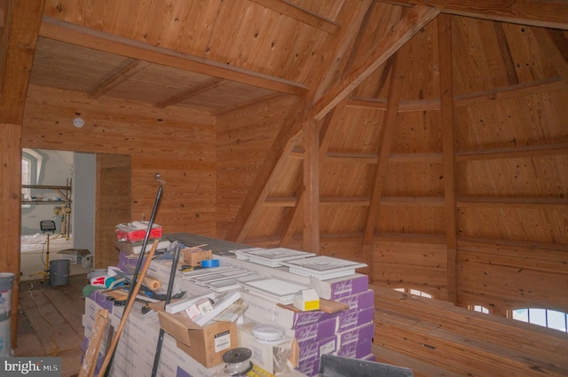 misc room with lofted ceiling, wood walls, hardwood / wood-style floors, and wood ceiling