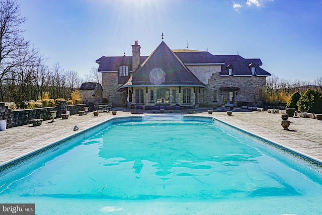 view of swimming pool with a patio