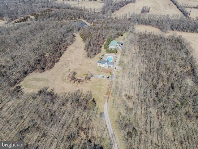 birds eye view of property with a rural view