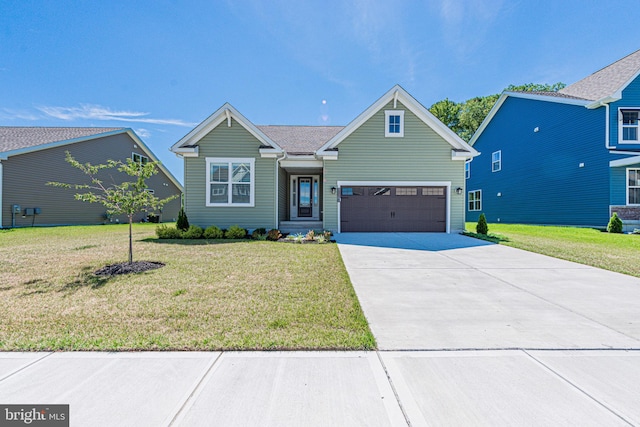 view of front of home with a front lawn and a garage