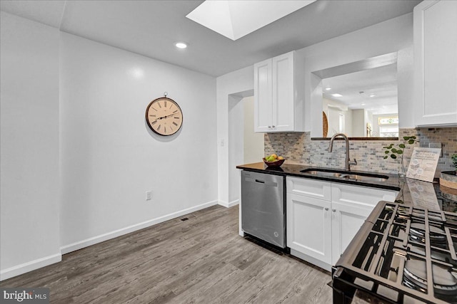 kitchen with sink, white cabinets, light hardwood / wood-style floors, and dishwasher