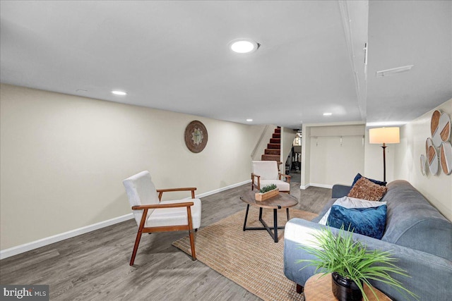 living room with dark hardwood / wood-style flooring