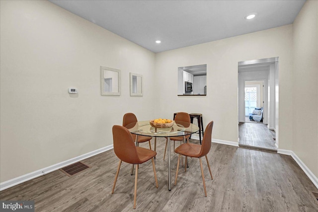 dining area featuring light wood-type flooring