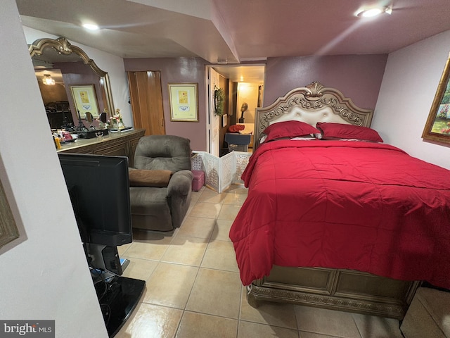 bedroom featuring light tile patterned floors