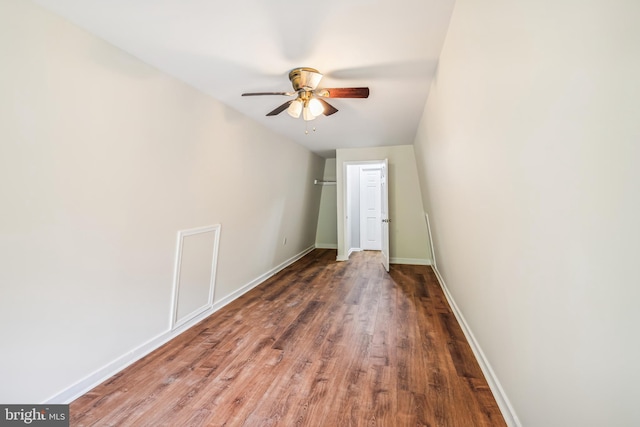 unfurnished bedroom featuring dark hardwood / wood-style floors and ceiling fan