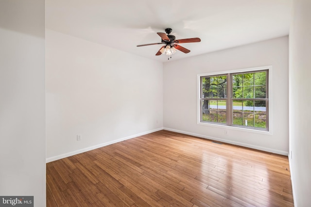 spare room with ceiling fan and light hardwood / wood-style floors