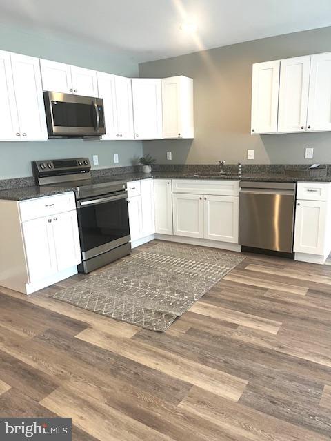 19 Pacific Ave, Milroy, PA 17063 - kitchen with stainless steel appliances and white cabinetry