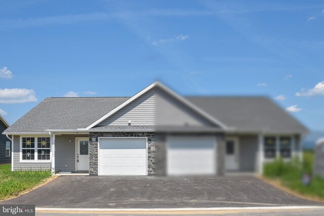 ranch-style home featuring a garage