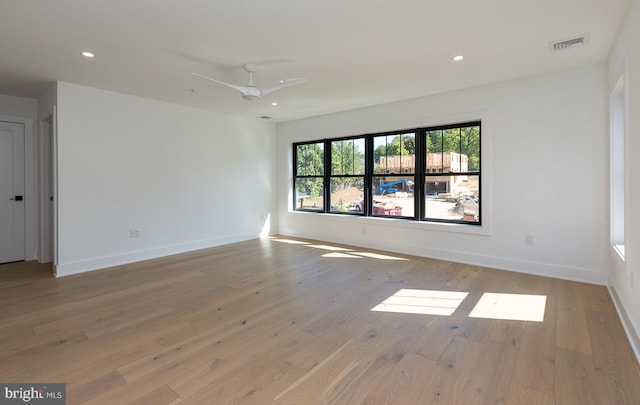 unfurnished room with light hardwood / wood-style flooring and ceiling fan