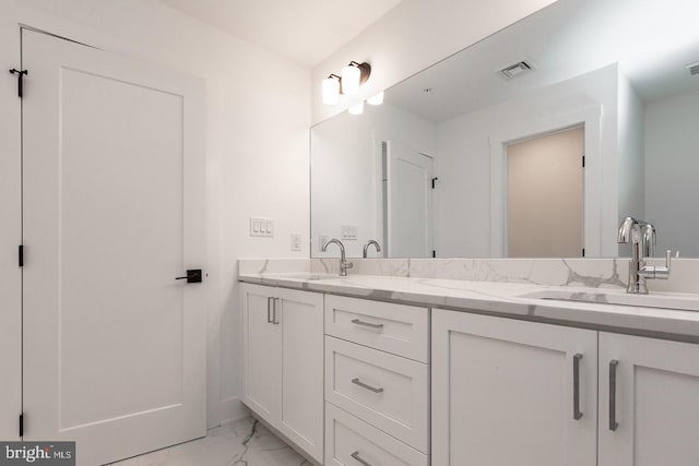 bathroom featuring double sink vanity and tile flooring