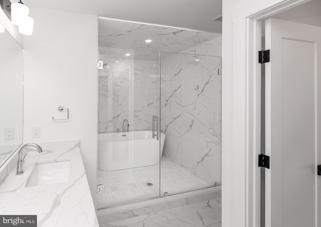 bathroom with tile floors, vanity, and a shower with shower door