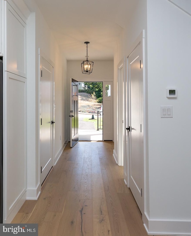 entryway with light hardwood / wood-style flooring