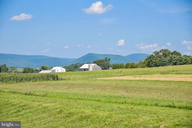 mountain view featuring a rural view