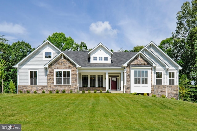 craftsman inspired home with a front yard