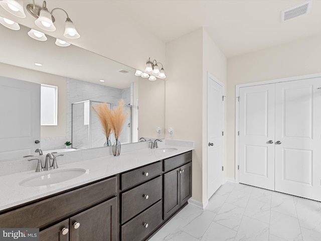 bathroom with vanity and an enclosed shower