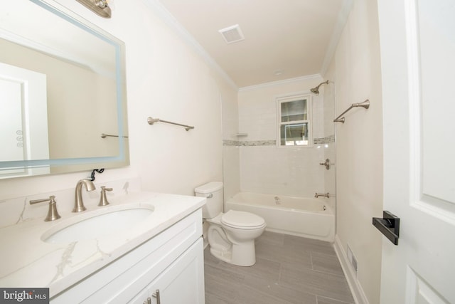 full bathroom with crown molding, tiled shower / bath combo, vanity, and toilet