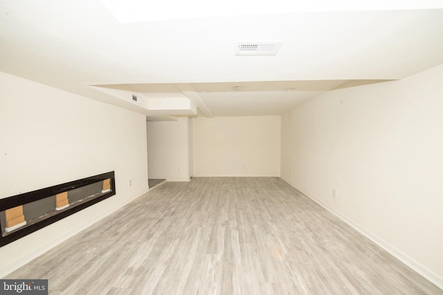 unfurnished living room with light hardwood / wood-style flooring