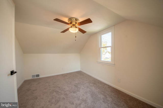 additional living space featuring lofted ceiling, ceiling fan, and carpet