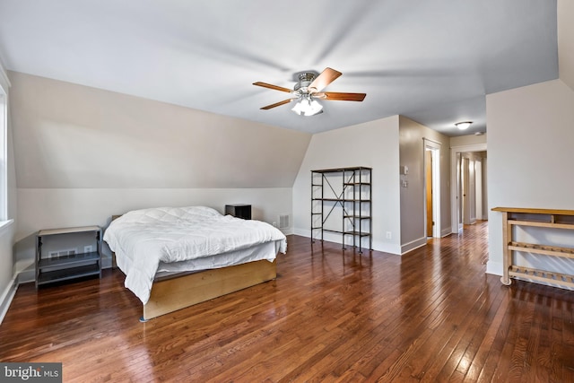 bedroom featuring ceiling fan, vaulted ceiling, and hardwood / wood-style floors