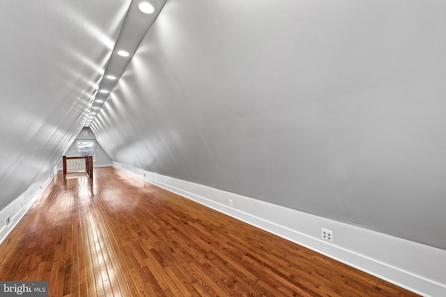 interior space featuring wood-type flooring and lofted ceiling