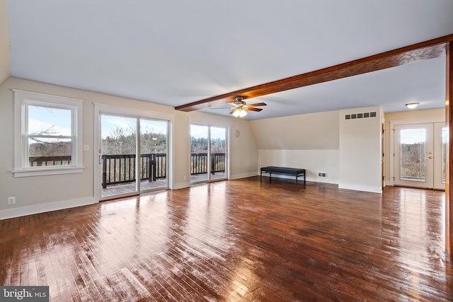 unfurnished living room featuring ceiling fan, lofted ceiling with beams, and wood-type flooring