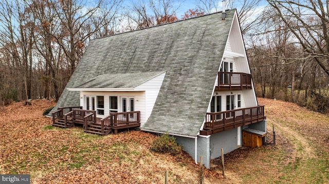 rear view of house with a deck