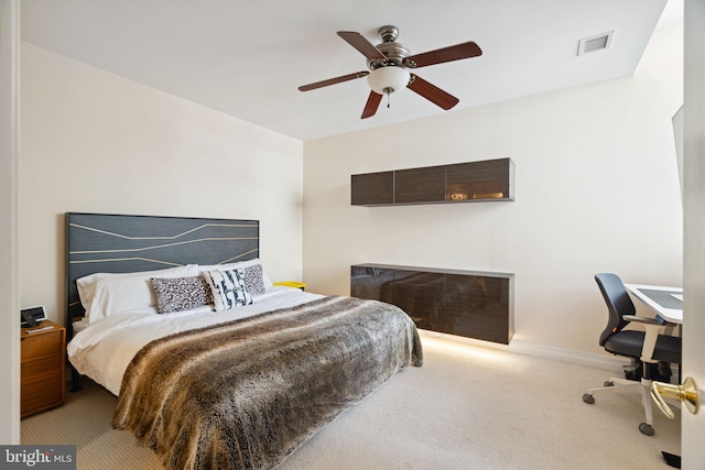 bedroom with light carpet and ceiling fan