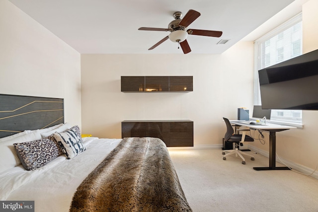 bedroom featuring ceiling fan and light colored carpet