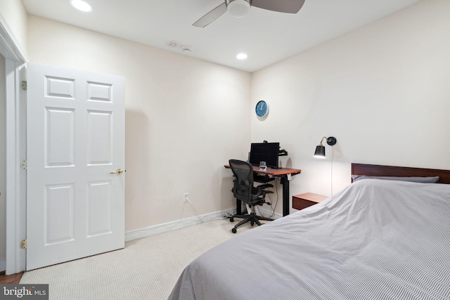 bedroom featuring light carpet and ceiling fan