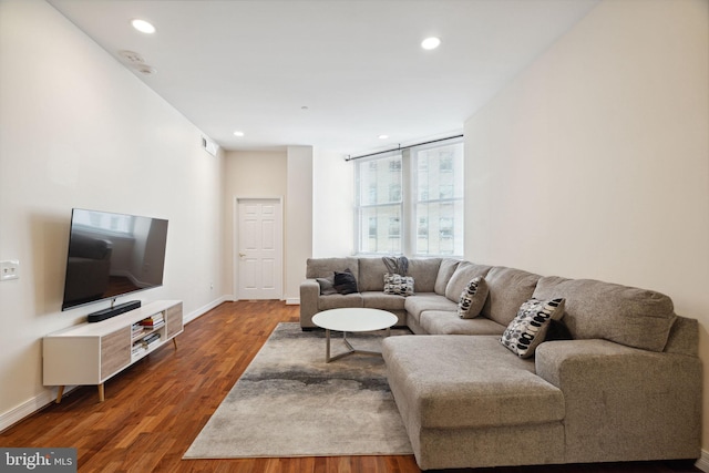 living room with dark hardwood / wood-style floors