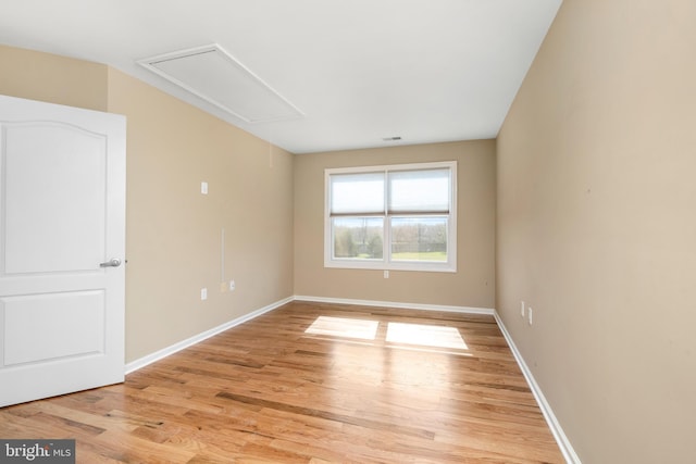 spare room featuring light wood-type flooring